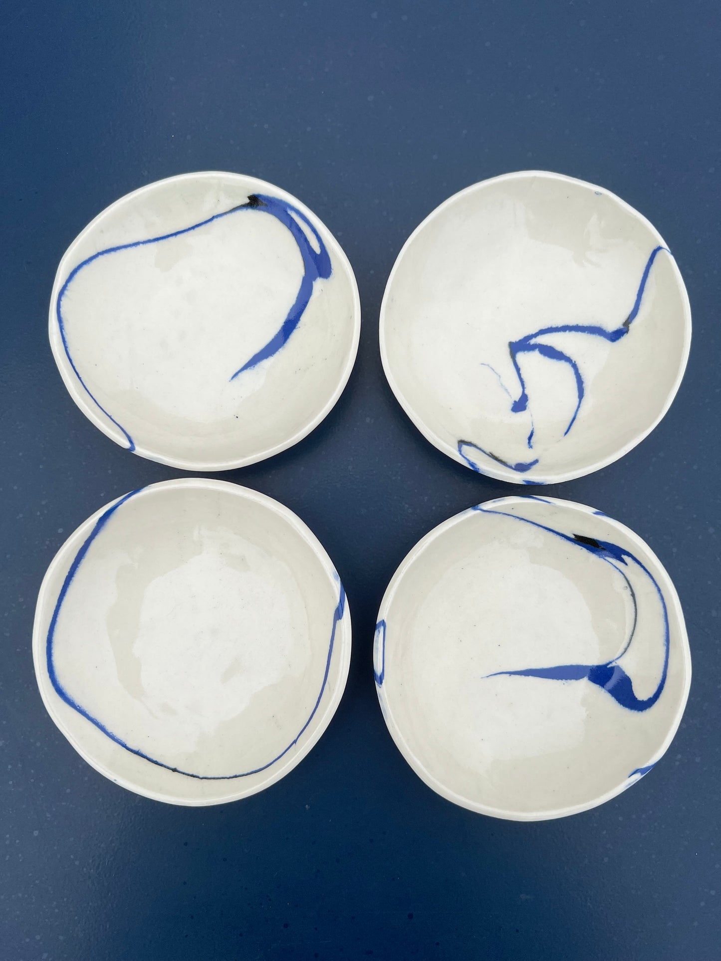 set of four marble blue and black side dishes