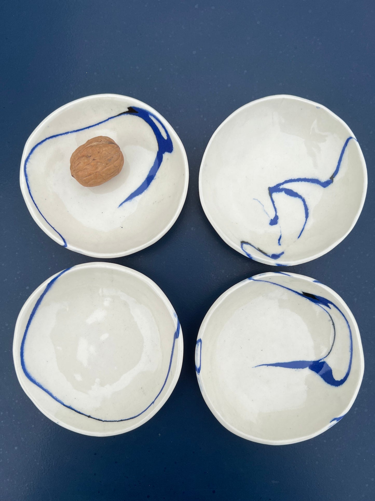 set of four marble blue and black side dishes