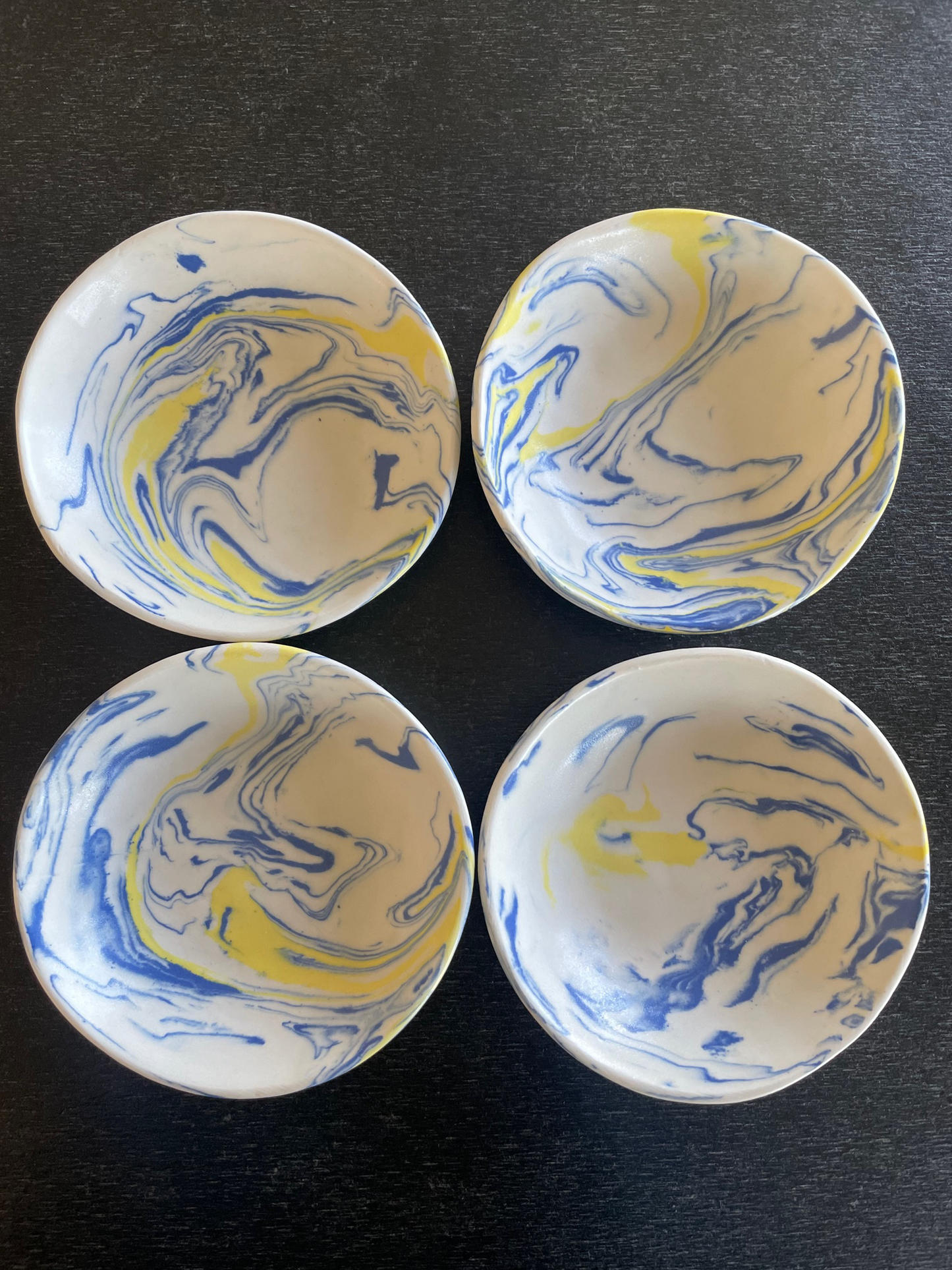 limited edition - set of four marble blue and yellow dishes